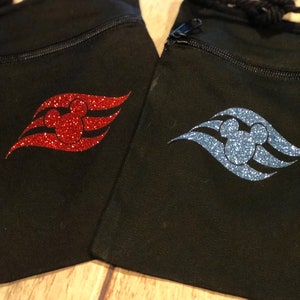 May include: Two black drawstring bags with a zipper closure. One bag has a red glitter Mickey Mouse head and the Disney Cruise Line logo. The other bag has a blue glitter Mickey Mouse head and the Disney Cruise Line logo.