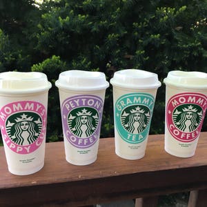 May include: Four white to-go cups with lids, each with a different design. The cups feature the Starbucks logo and the text "Mommy's Sippy Cup", "Peyton's Coffee", "Grammy's Tea", and "Mommy's Coffee".