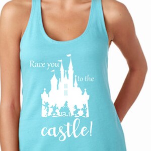 May include: A turquoise blue racerback tank top with a white graphic of a castle and the text "Race you to the castle!"