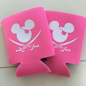 May include: Two pink neoprene can coolers with a white Mickey Mouse head and crossed swords design.