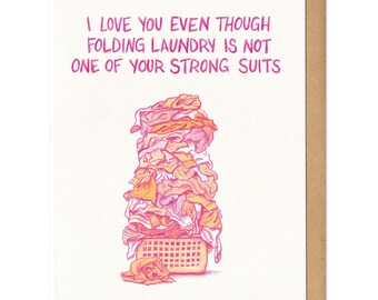 Tarjeta de felicitación con texto "Love" y "Doblar la ropa"