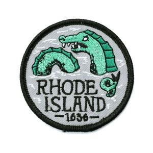May include: A white and gray embroidered patch with a green sea serpent and the text "RHODE ISLAND -1636-"
