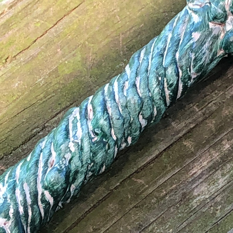 Green and White Handled Wand with Black Skull