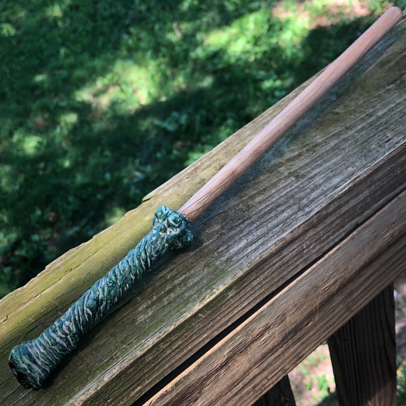 Green and White Handled Wand with Black Skull