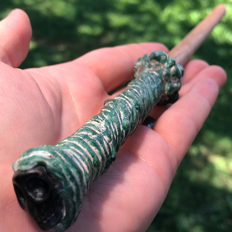 Green and White Handled Wand with Black Skull