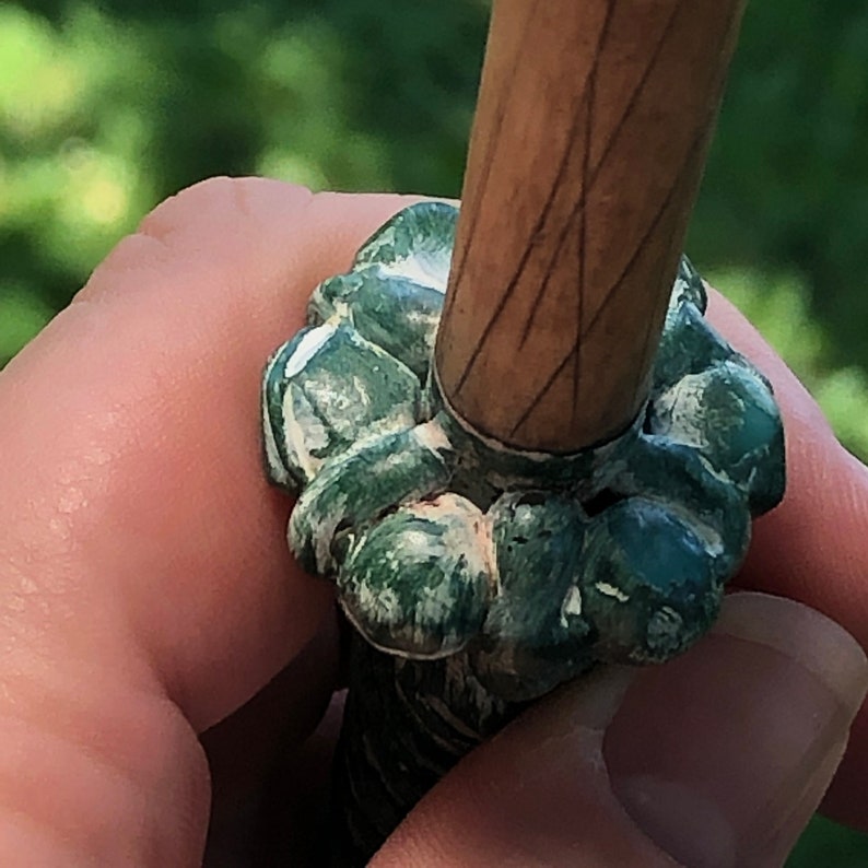 Green and White Handled Wand with Black Skull