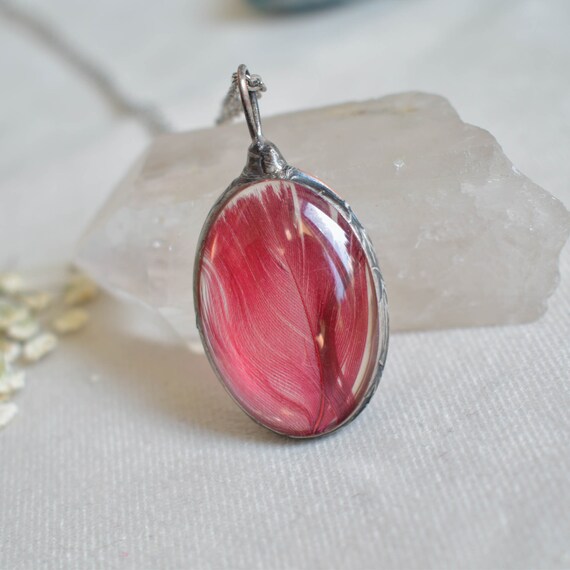 Red online feather pendant