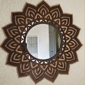 May include: A rustic wooden sign with the text "Welcome to our home" in white lettering. The sign features a distressed finish and a simple, inviting design, perfect for entryway decor.