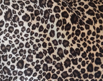 Soft stretchy Cheetah velour or poly blend. Brown and Tan small spots. 2 yards by 66" wide. More stretch width than length. Nice!