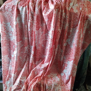 Upscale Polyester stretch fabric Deep Orange/White florals. Feels good! Make CAFTAN, dress, slacks, long skirt! 60 x 72. 2 yds.