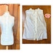 see more listings in the Blouses Tops & Pants section