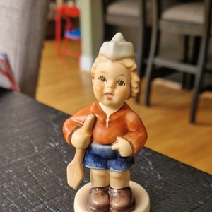 Hummel boy with umbrella and suitcase cheap