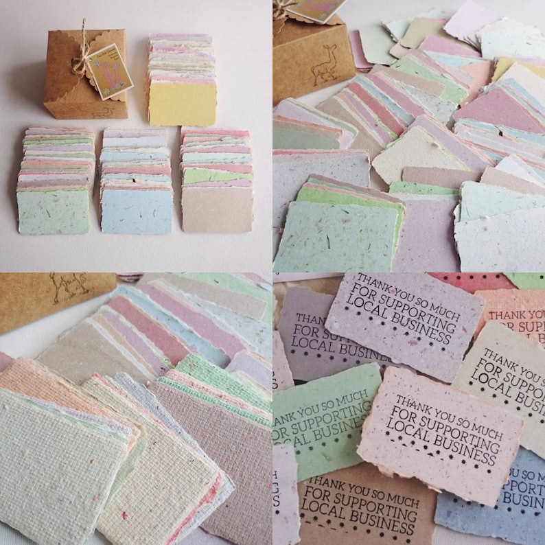 May include: A box of colorful handmade paper thank you cards with the text "Thank you so much for supporting local business" printed on them.