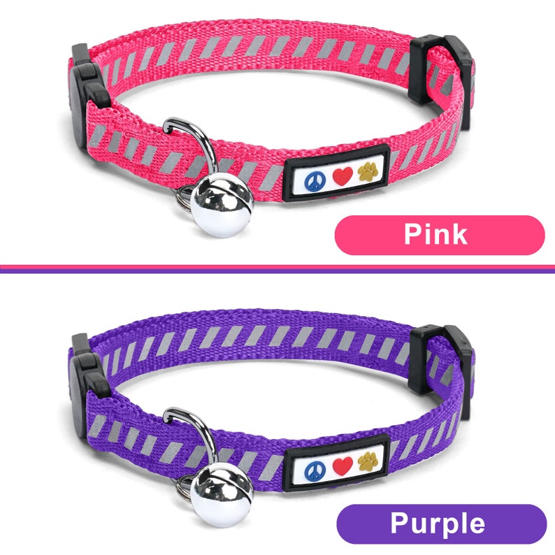 May include: Two cat collars with a bell and a peace sign, heart, and paw print charm. The collar on the top is pink with silver reflective stripes. The collar on the bottom is purple with silver reflective stripes.