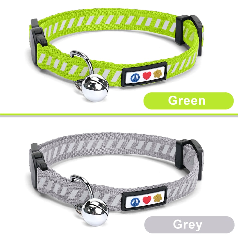 May include: Two cat collars with a bell and a peace sign, heart, and paw print charm. The collar on the top is green with white stripes and the collar on the bottom is grey with white stripes. Green and Grey.