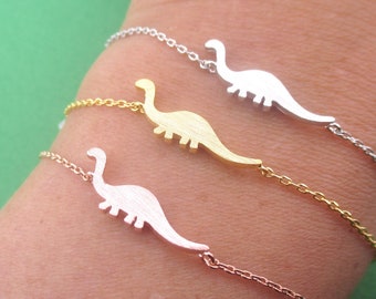 Pulsera con dije de silueta de dinosaurio paleontólogo, apatosaurio y brontosaurio, en plata, oro o oro rosa. Joyería animal hecha a mano.