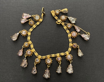 Dior 1950s Mitchel Maer charm bracelet, golden chain and charms with hand set stones in heather lavender