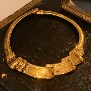 1980s Vintage Givenchy large pendant ribbon wave design gold plated Necklace