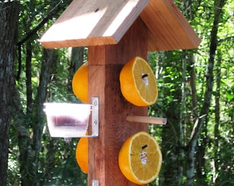 Cedar wooden birdfeeder for orioles - serve fruit and jelly from this double sided hanging bird feeer  to attract fruit eating wild birds