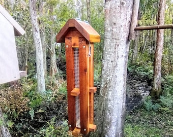 Attract blue Jays and woodpeckers with this hanging cedar wood peanut feeder - Dispenses shelled peanuts / peanut pieces