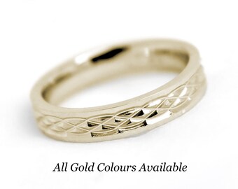 May include: A gold-colored ring with a repeating diamond pattern around the band. The ring is set against a white background. Text at the bottom reads "All Gold Colours Available".