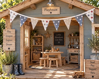 May include: A wooden playhouse with blue-gray siding, a peaked roof, and a bunting banner featuring stars and dots. The interior includes a wooden table, stools, a shelf with a teddy bear, a chalkboard reading Little Adventures Live Here, and a toy kitchen. Signs display Play, Imagine, Explore, Dream and Good Play Happens Here.