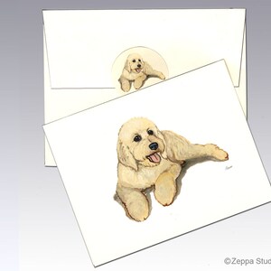 May include: A white doodle dog with a happy expression, lying on its side with its tongue sticking out. The dog is painted in a realistic style on a white background.