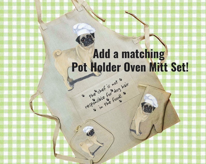 May include: A beige kitchen apron with a pug wearing a chef's hat. The apron has a pocket with the text "the chef is not responsible for dog hair in the food!" and a matching pot holder and oven mitt set with the same pug design.