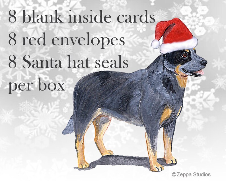 May include: A blue heeler dog wearing a red Santa hat, standing on a white snowflake background. The text on the image reads: "8 blank inside cards, 8 red envelopes, 8 Santa hat seals per box".