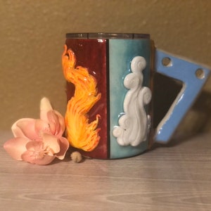 3D Avatar Elements Kaffeebecher Becher mit Boomerang Griff - Sculpted Clay on a 15 oz skinny Edelstahl Isolierter Becher