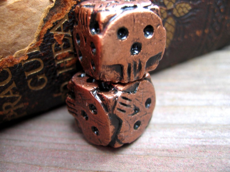 hand cast copper color skull dice oogie boogie dice geek