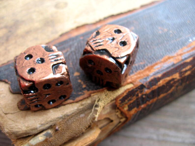 hand cast copper color skull dice oogie boogie dice geek