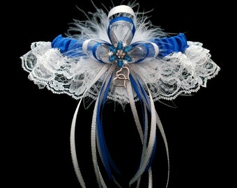 Liga de boda de encaje azul real con flores de diamantes de imitación y plumas