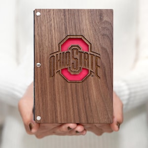 May include: A wooden photo album with a red and brown Ohio State University logo.