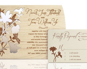 May include: A wooden wedding invitation with a floral design. The invitation reads "Norah Jane Thiebold and Tom William Ye together with their families request the honour of your presence as they exchange vows and become husband and wife on Saturday, the seventeenth of September, two thousand and twenty-two at half past six o'clock in the evening at Saint William Church, 367 East 260th Street."