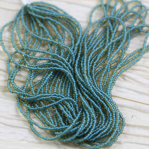 11/0 Topaz /  Blue  Lined Czech seed beads - 1 hank- 12/20&quot;