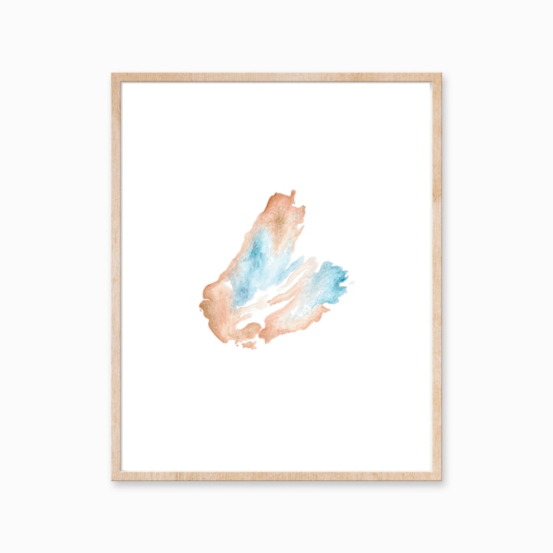 May include: A framed watercolor painting of a blue and orange abstract shape on a white background.