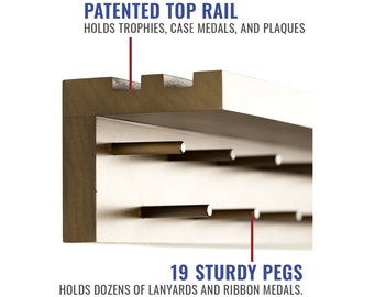 May include: A wooden display shelf with a top rail for trophies, medals, and plaques. The shelf has 19 sturdy pegs for hanging lanyards and ribbon medals. "PATENTED TOP RAIL" and "19 STURDY PEGS" are printed on the image.