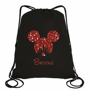 May include: Black drawstring bag with a red glitter Mickey Mouse head and the name "Brooke" in red glitter.
