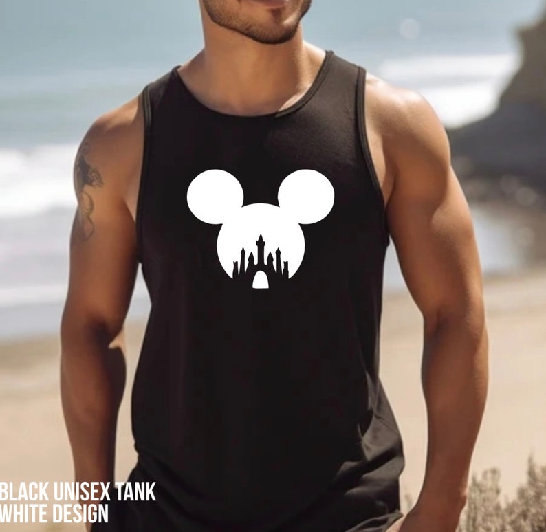 May include: Black tank top featuring a white design of Mickey Mouse ears with a silhouette of the Disney castle inside the ears.