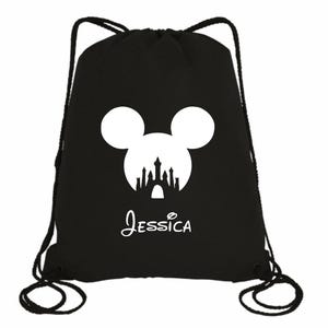 May include: Black drawstring bag with a white silhouette of Mickey Mouse's head with the Disney castle inside. The bag has the name "Jessica" printed below the image.