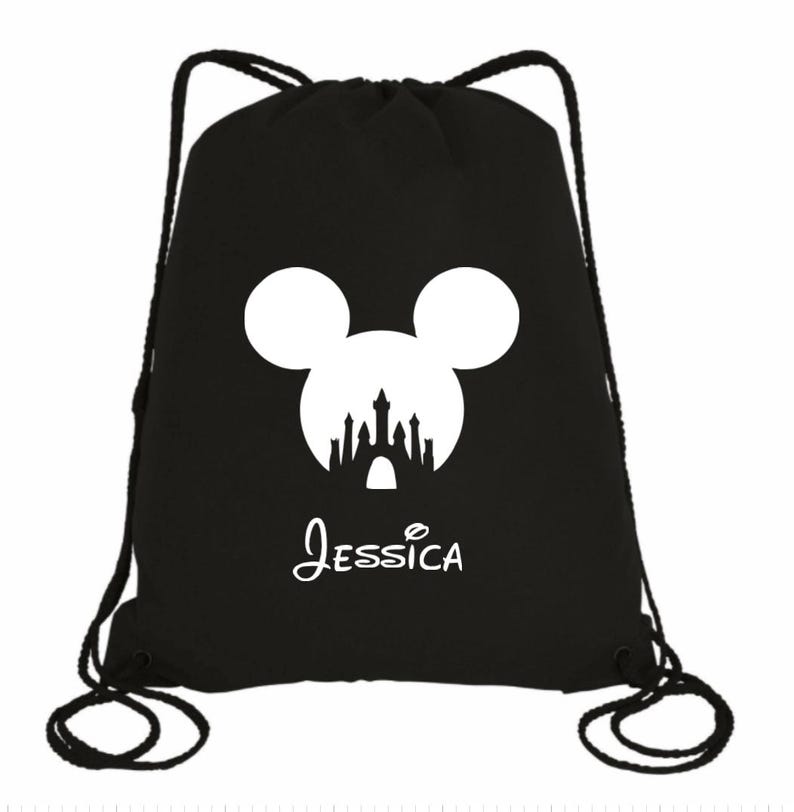 May include: Black drawstring bag with a white silhouette of Mickey Mouse's head with the Disney castle inside. The bag has the name "Jessica" printed below the image.