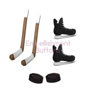May include: A collection of hockey-themed embellishments. The image features two brown and white hockey sticks, two black ice skates with white laces, and two black hockey pucks. The items are set against a white background.