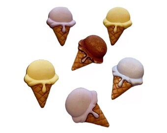 May include: A collection of six ice cream cone-shaped decorative items. The ice cream scoops are in various colors, including light pink, yellow, brown, and white. The cones are a light brown color.