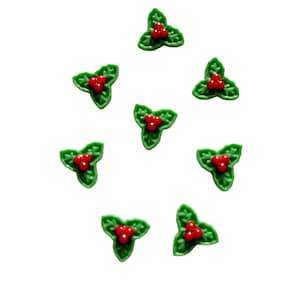 May include: A collection of eight green holly leaf decorations with three red berries each. The decorations are arranged in a circular pattern against a white background, perfect for holiday crafts and festive projects.