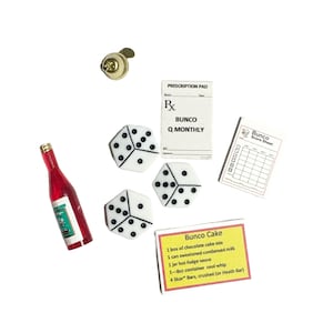 May include: An assortment of game night items, including three white dice with black dots, a red bottle, a prescription pad labeled "Bunco Q Monthly", a score sheet, and a recipe card for "Bunco Cake". A gold-colored button is also present.