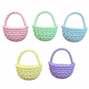 May include: Five small, semi-circular baskets arranged in two rows. Each basket features a woven-style texture and a single arched handle. The colors are pastel pink, light green, light blue, pale yellow, and light purple, all with a matte finish.