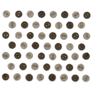 May include: A collection of small, round buttons in two colors: light gray and dark brown. Each button has two holes for sewing. The buttons are arranged in a grid pattern against a white background.