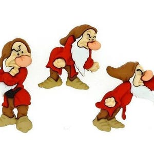May include: Three cartoon dwarf figurines in various poses. Each dwarf has a brown hat and hair, a white beard, and a red tunic. The dwarfs have tan skin and are set against a white background.