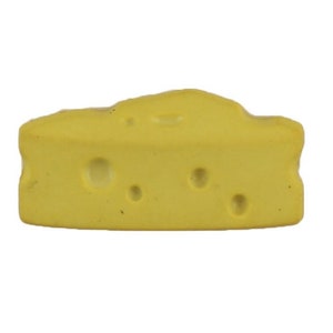 May include: A wedge of yellow cheese with several holes. The cheese has a slightly irregular shape and a textured surface, suggesting a natural appearance. The cheese is isolated on a white background.